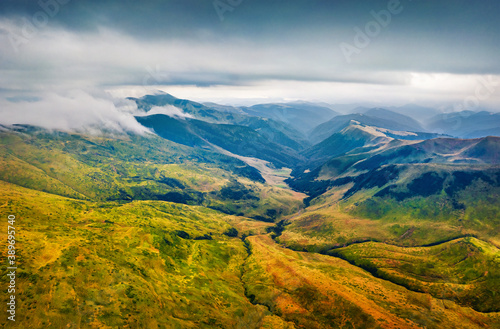 Dramatic summer scene of Svydovets mountain range with Blyznytsi peak on background. Stunning morning view of misty Carpathian mountains, Ukraine, Europe.