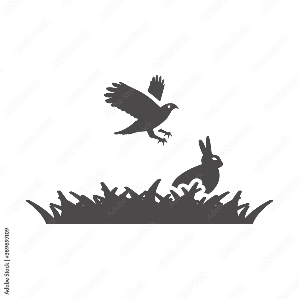 Bird of prey hunt a rabbit in the grass icon. Bird of prey hunt a rabbit in the grass icon.