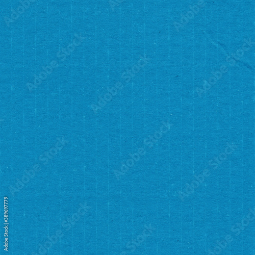 A blue vintage rough sheet of carton. Recycled environmentally friendly cardboard paper texture. Simple minimalist papercraft background. © artistmef