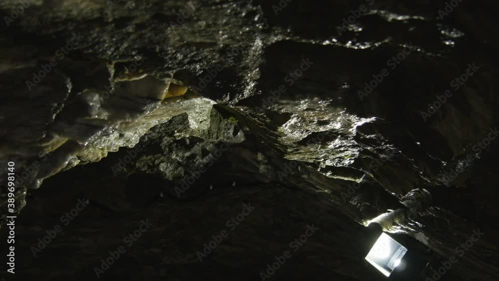 Walk through a dark cave. Speleology and geology theme 4k video. Walk through a dark cave. Speleology and geology theme 4k video.