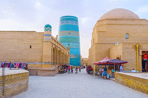 The brick town and blue tile Kalta Minor minaret, Khiva, Uzbekistan photo