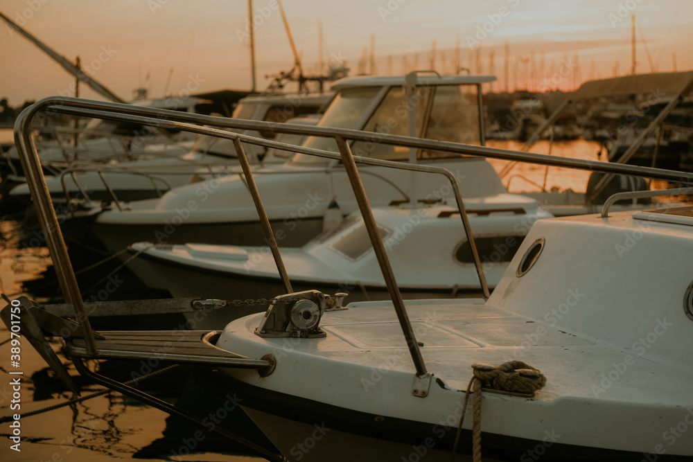 Fototapeta premium There are many yachts, boats and ships at sea. Marina at sunset.