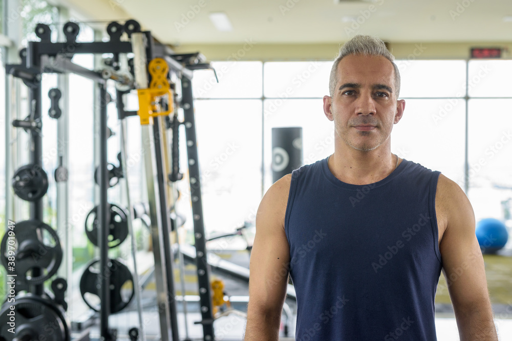 Portrait of mature handsome Persian man at the gym Portrait of mature handsome Persian man at the gym