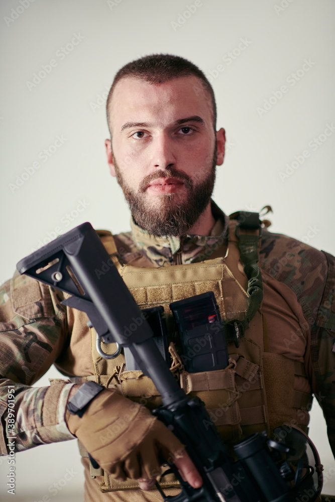 Fototapeta premium modern warfare soldier portrait in urban environment