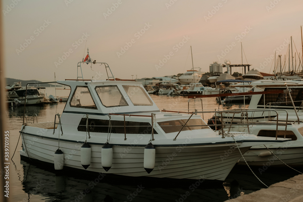 Fototapeta premium There are many yachts, boats and ships at sea. Marina at sunset.