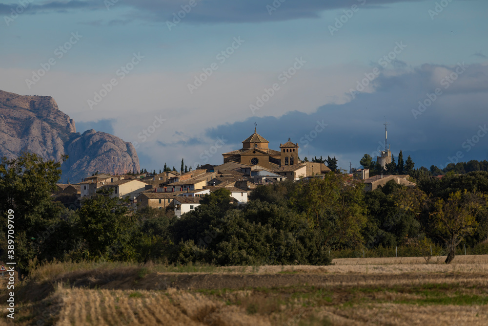 General view of the town of Biscarrues, province of Huesca, Pre-Pyrenees Aragon. In the background, big mountain of Mallets of Aguero.