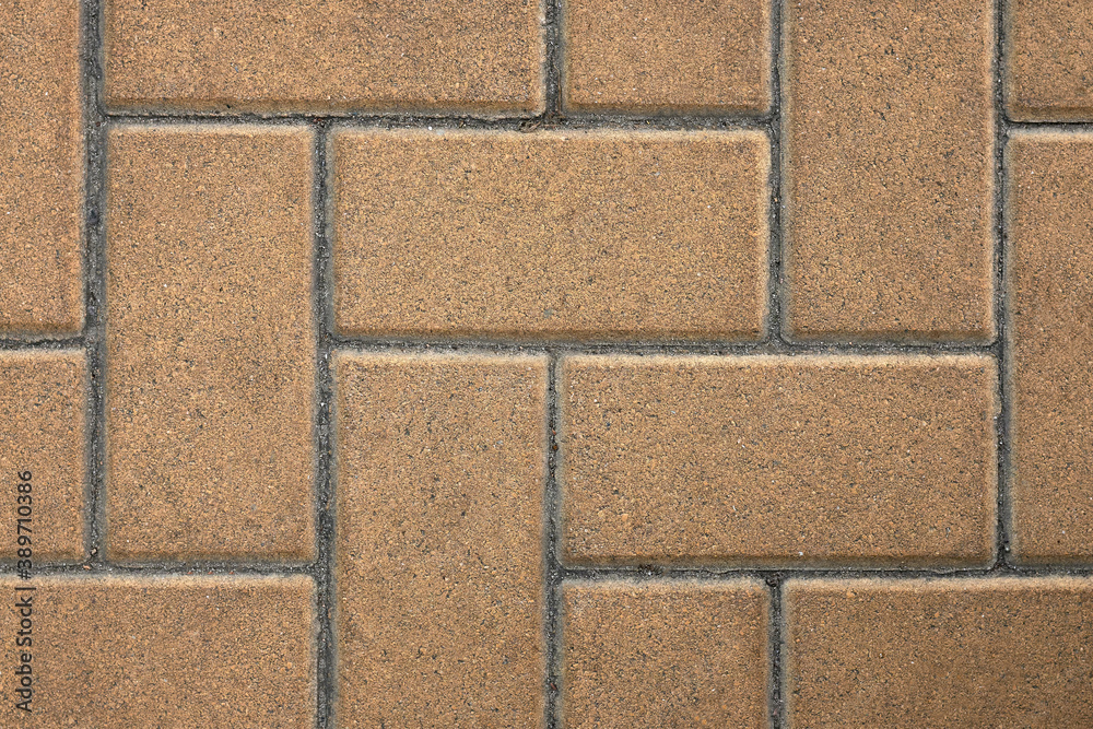 Fototapeta premium Sidewalk tiles, close up city road made of stone.