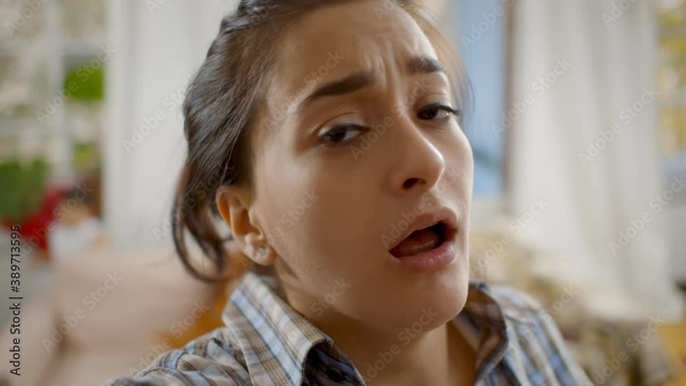 Pov shot of young woman having video call with kids playing on blurred background Pov shot of young woman having video call with kids playing on blurred background