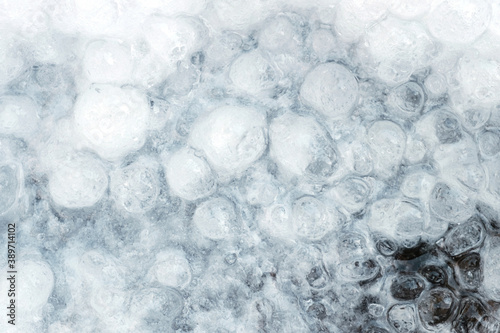 Winter background of a frozen water © Luka