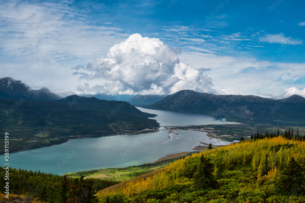 Beautiful View of a small Touristic Town, Carcross, surounded by Canadian Mountain Landscape. Located near Whitehorse, Yukon, Canada.