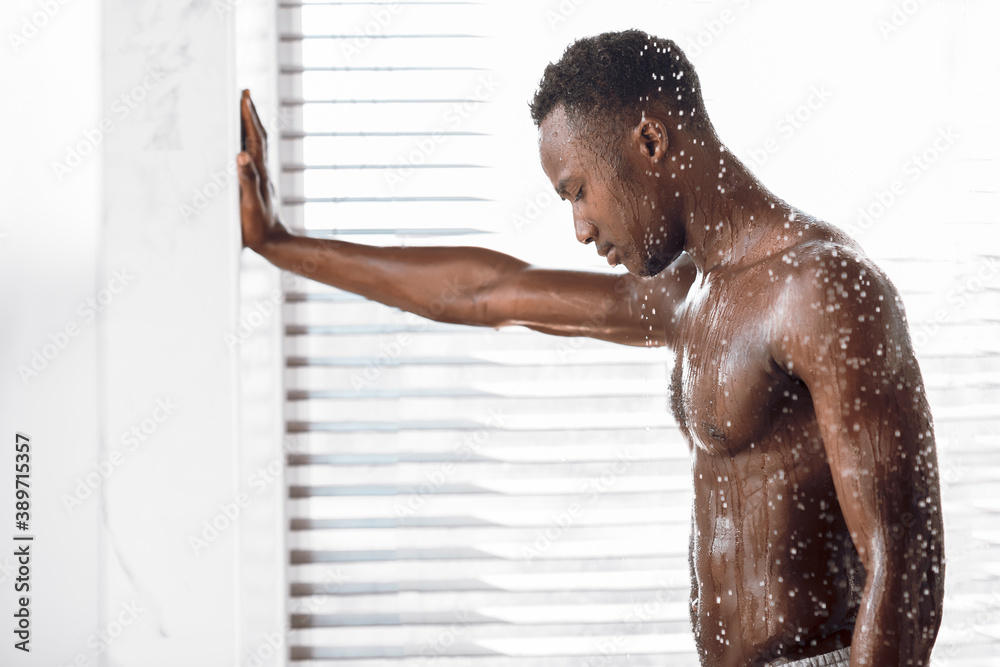 Naked Black Guy Taking Shower Washing Body In Modern Bathroom Stock Photo |  Adobe Stock