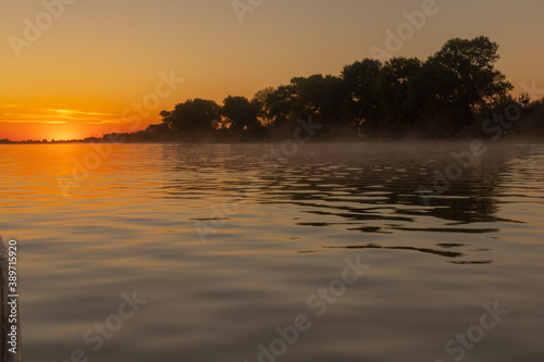 sunrise over the river © Ioan