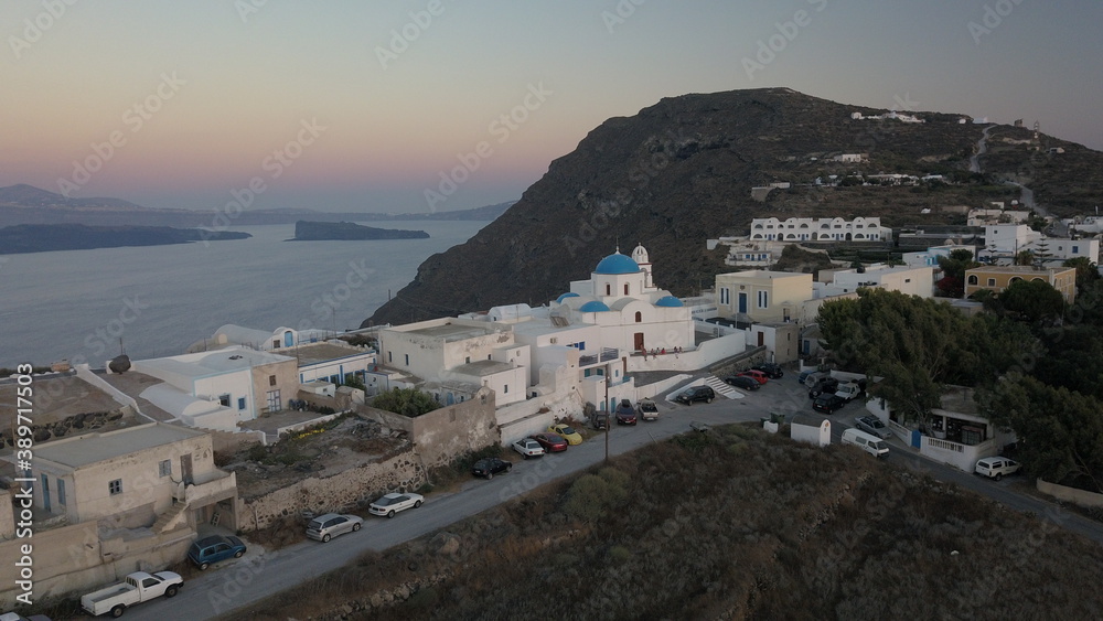 Aerial view flying small town on Santorini Greece