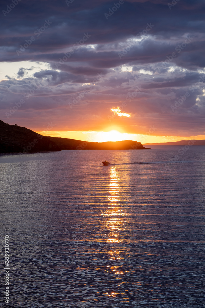 Kea, Tzia island, destination Greece. Sunset, sunrise orange through clouds background
