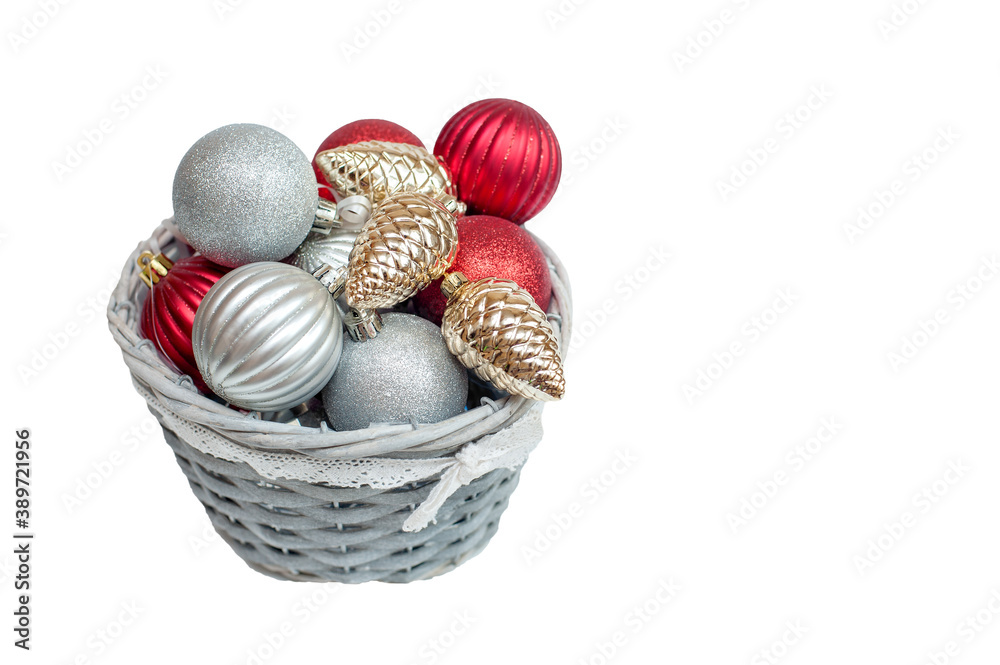 Christmas decorations in a basket on a white background Christmas decorations in a basket on a white background