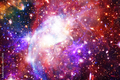 Colorful starry outer space background. The elements of this image furnished by NASA. © wowinside