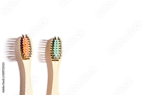 Eco-friendly bamboo toothbrushes on white background. Natural organic  product concept. Flat lay  top view  copy space.