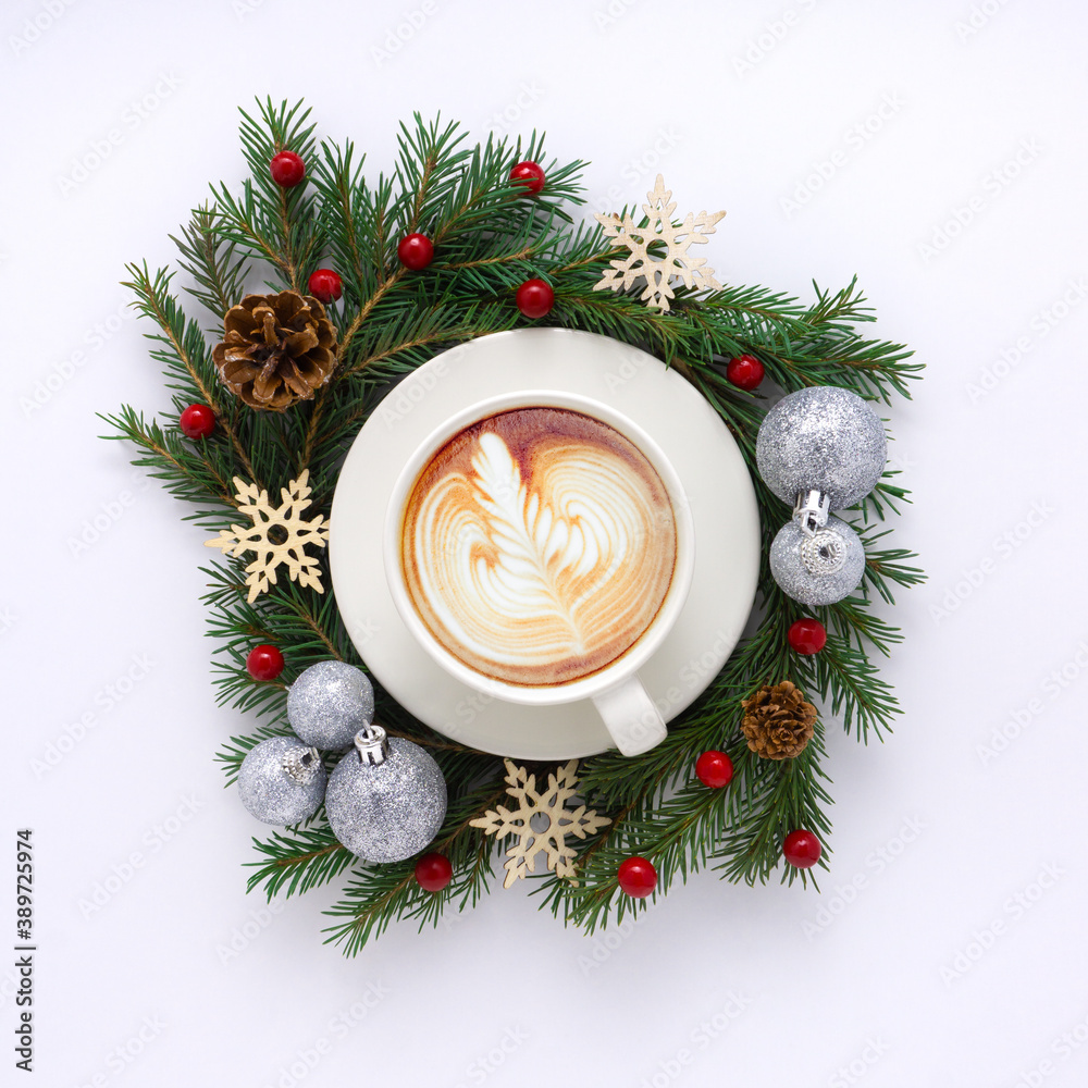 Creative concept holiday celebration photo of christmas toys balls decoration with coffee cup on white background. Creative concept holiday celebration photo of christmas toys balls decoration with coffee cup on white background.