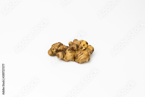 Fresh ginger on isolated white background, herb medical concept