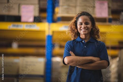 Fototapeta Portrait of African American worker in warehouse, International export business