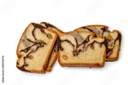 Slices of Romanian sponge cake with cocoa, turkish delight and raisins
