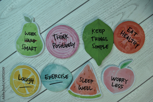 Healthy Lifestyle Concept and keywords write on sticky notes isolated on Wooden Table.