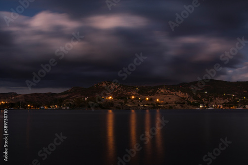 long exposure shot that includes sea, mountain, clouds. sunset or sundown landscape image from Izmir, Turkey.