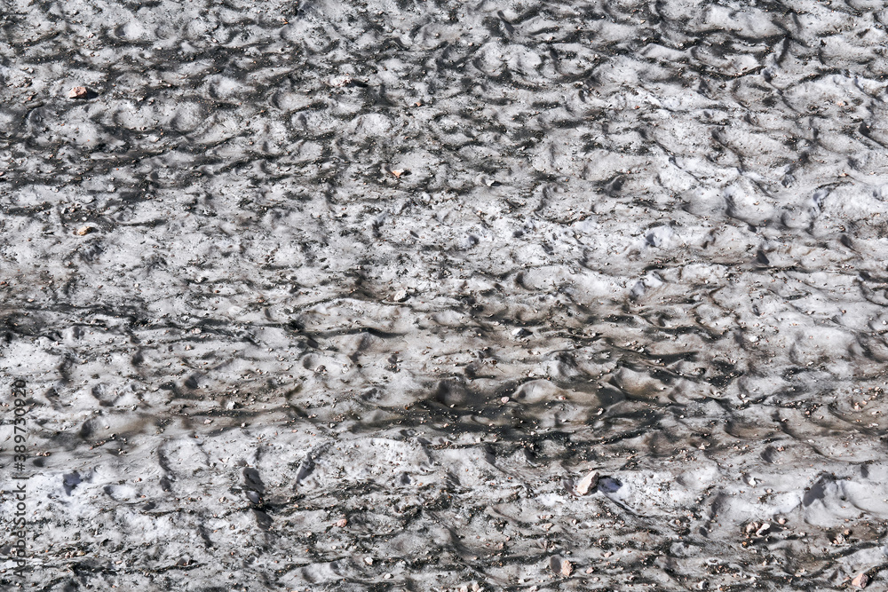 surface of a melting mountain glacier covered with dust and rubble surface of a melting mountain glacier covered with dust and rubble