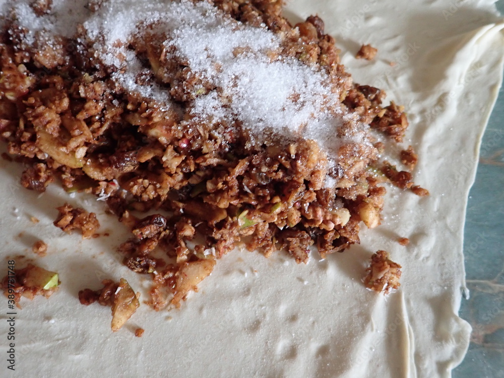 Fototapeta premium preparation of a homemafe apple strudel