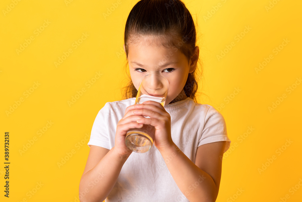 Portrait of asian child drinking spring water Portrait of asian child drinking spring water