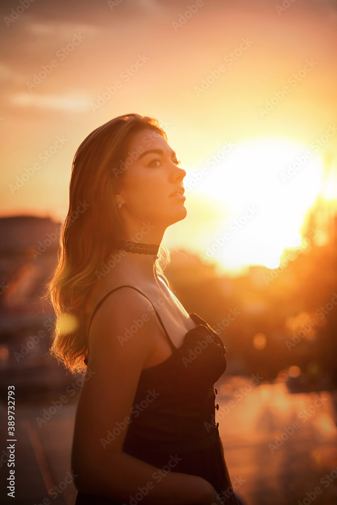 
Girl in the old city at sunrise