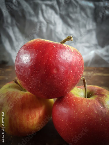 red apples on wooden background