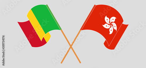 Crossed and waving flags of Mali and Hong Kong