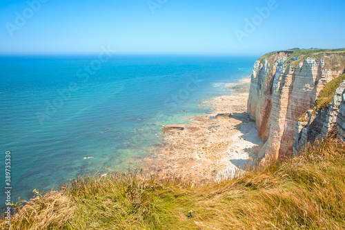 The chalk cliffs in Etretat in french Normandy, atlantic coast of France. Summer view of atlantic ocean.