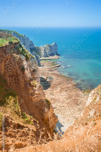 The chalk cliffs in Etretat in french Normandy, atlantic coast of France. Summer view of atlantic ocean.