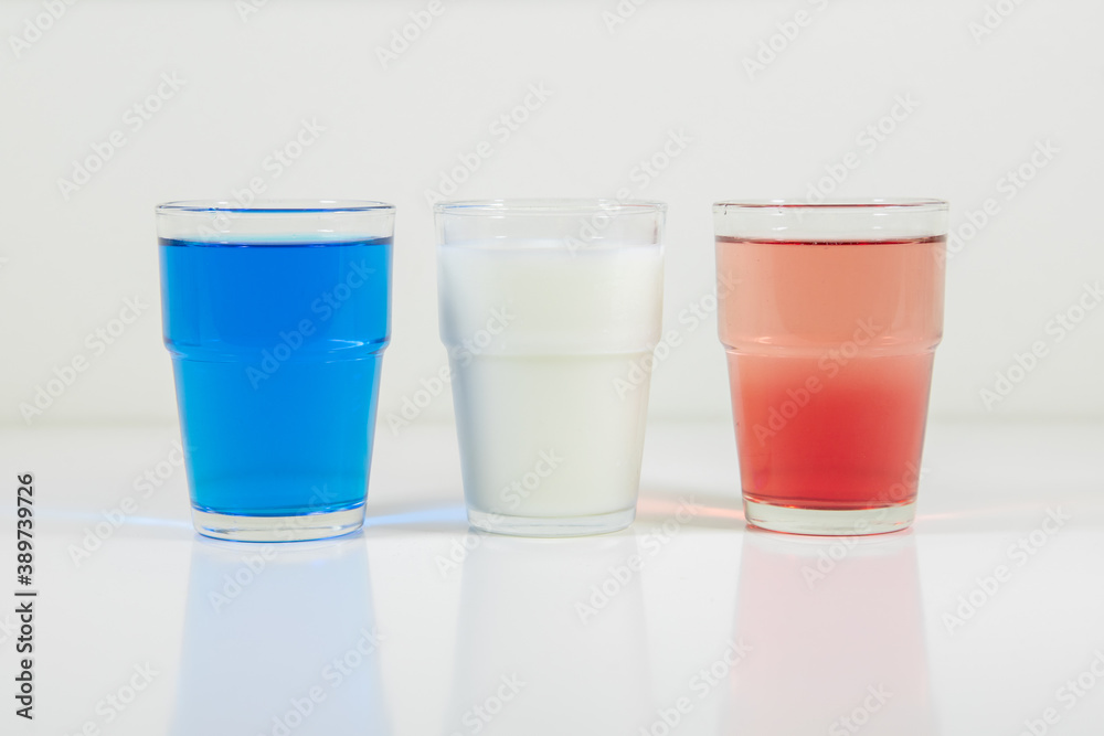 Glasses of lemonade in colors representing flag of France. It is a photo in a series of similar photos perfect to use in a quiz. Glasses of lemonade in colors representing flag of France. It is a photo in a series of similar photos perfect to use in a quiz.
