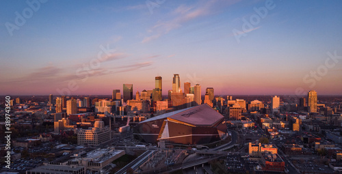 Drone flight over the skyline of Minneapolis, Minnesota USA with a nice view to the US Banks Stadium from the Vikings  photo