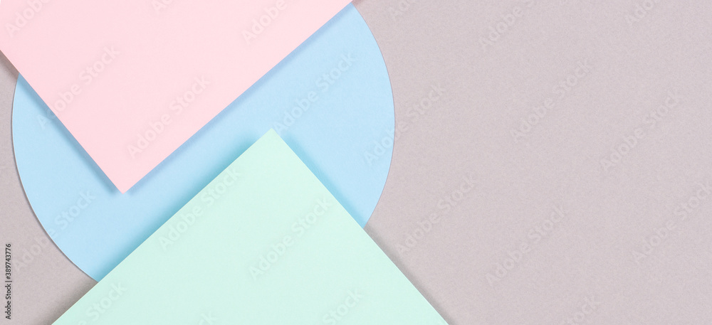 Abstract geometric texture background of fashion soft green, pastel pink, light blue, gray color paper. Top view, flat lay Abstract geometric texture background of fashion soft green, pastel pink, light blue, gray color paper. Top view, flat lay