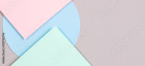 Abstract geometric texture background of fashion soft green, pastel pink, light blue, gray color paper. Top view, flat lay