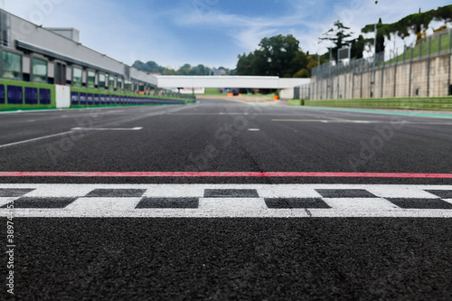 Motor sport circuit asphalt track starting line checkered sign front view © fabioderby