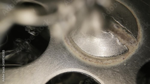 Water flowing down the drain, macro shot with probe lens photo