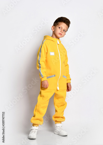 Boy in trendy warm sportive jumpsuit portrait