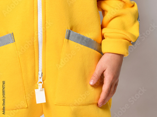 close detail of kids hoodie sweatshirt with zip fastener.