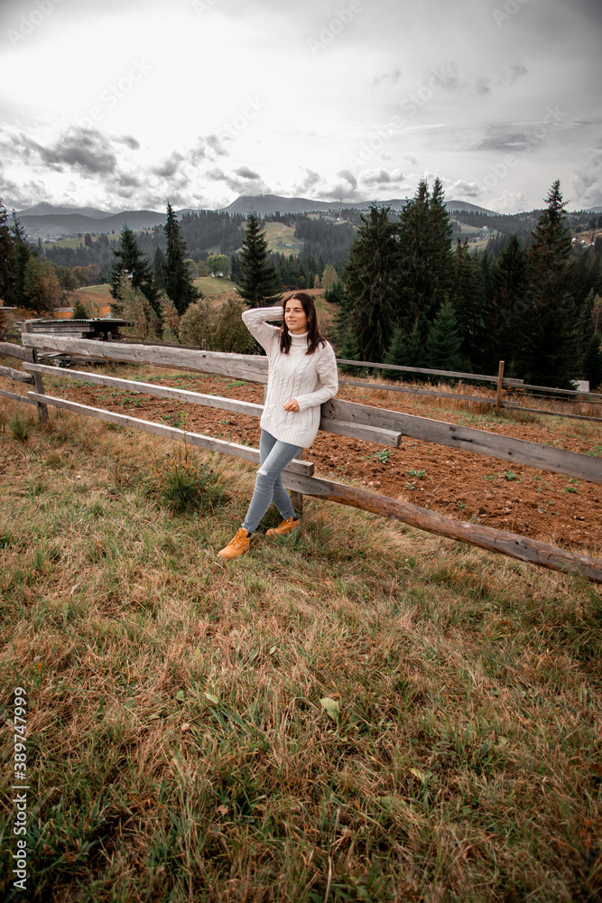 portrait of a young pretty girl who stands alone against a
background of mountains. beautiful sky, beautiful nature portrait of a young pretty girl who stands alone against a
background of mountains. beautiful sky, beautiful nature