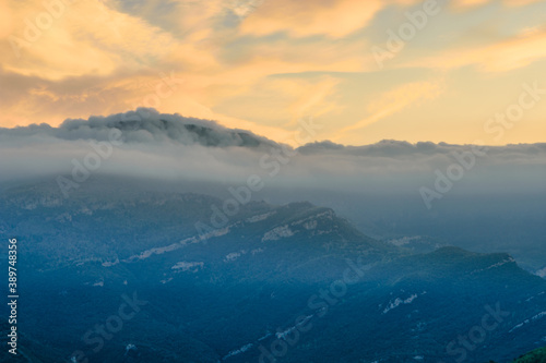 Sunrise in the mountains (the Peak of Comanegra covered with fog - Alta Garrotxa, Catalonia, Spain)