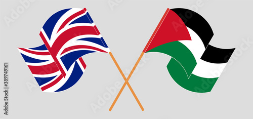 Crossed and waving flags of Palestine and the UK