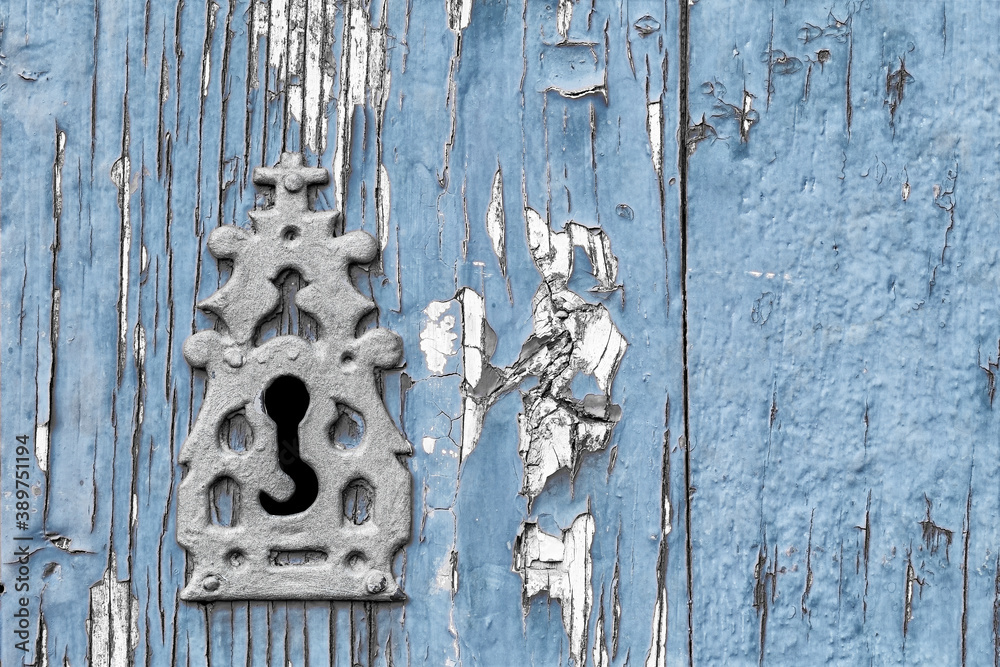 old  keyhole on vintage blue planks wooden , background