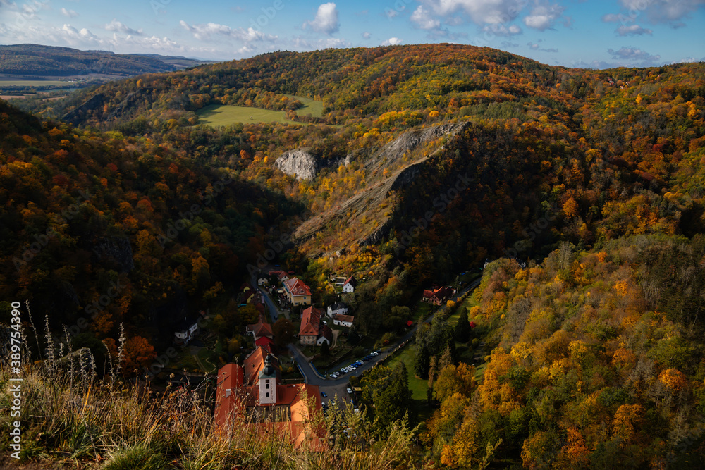 Romantic medieval village with monastery in autumn, Saint John under the Cliff (Svaty Jan pod Skalou), Central Bohemia, Czech Republic