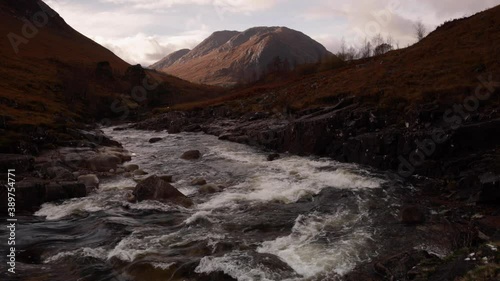 long exposure shot of the waterfalls in glen etive near loch etive and the entrance to glencoe and rannoch moor in the argyll region of the highlands of scotland during autumn