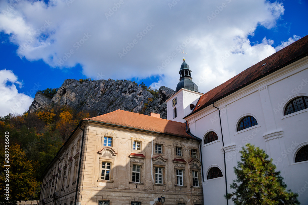 Obraz premium Romantic medieval village with monastery in autumn, Saint John under the Cliff (Svaty Jan pod Skalou), Central Bohemia, Czech Republic